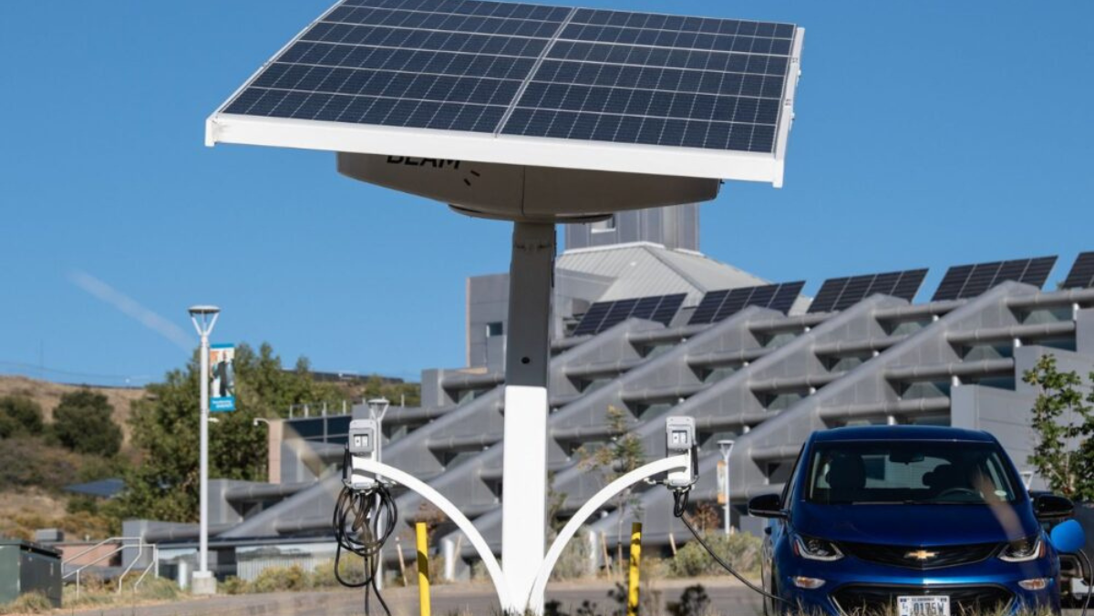 Electric vehicle charging from solar-powered station in vehicle-to-grid pilot